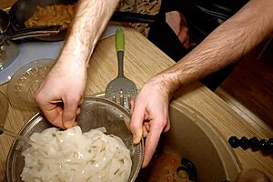 Naked Chef Prepares Rice Noodle Dish