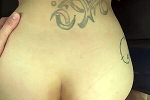 Busty hooker rides reverse cowgirl in a car, taking a load on her thick ass in broad daylight.