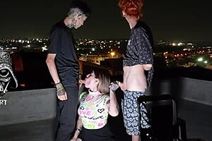 young girl teases two gifted men on the roof?