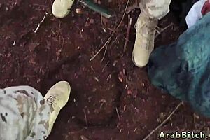 strapon mistress dominates outdoors with army vibe