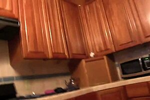 Lesbians using sex toys in the kitchen