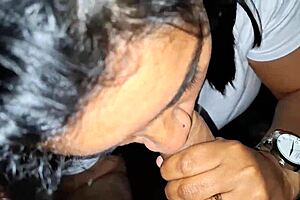 A woman strips naked in the city square and gets cum in her mouth