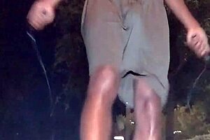 Brunette teacher picks up weights in workout.