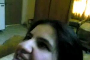 In this amateur webcam video, a couple enjoys blowjob and facial on her round ass.