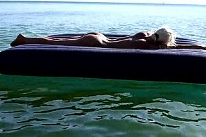 beautiful blonde model nude on beach, big tits exposed