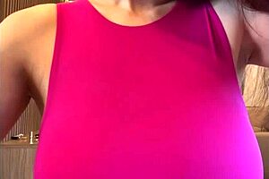 in this homemade video, the stepmother sucks her big milky tits outdoors