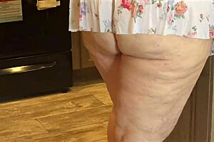 Busty MILF maid flashes pussy in mini dress