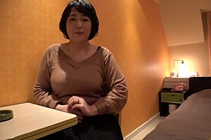 Treasured footage captures pregnant Japanese milf with big natural tits relaxing in hotel.