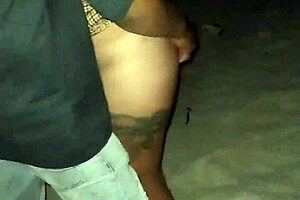 Horny tattooed Latina fingered outdoors on public beach