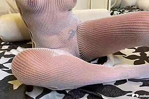 check out this brunette milf ripping fishnets to play with her wet slit!