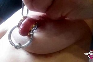 Nippleringlover's Kinky Mommy Stretches Extreme Pierced Nipples Close-Up