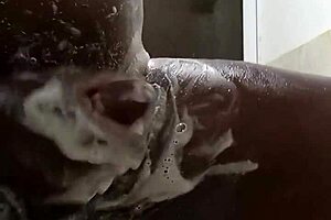 Horny guy strokes huge cock in steamy shower solo