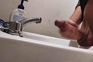 skinny solo dude teases huge cock balls on sink building to massive cumshot
