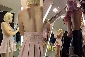 spy cam catches juicy pussy upskirt in changing room as crossdresser flashes nipples thru see-thru skirt