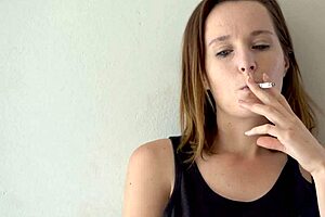 hot brunette babe smokes and teases voyeur style