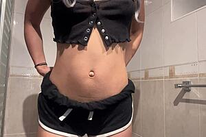 cute cheerleader sneaks into coach's bathroom feeling extra frisky today