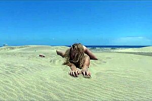 Sasha Bikeeva drives showing ass in micro-bikini dunes