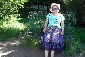 Hairy Mature Teases In See-Through Dress Outdoors