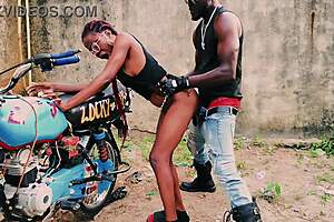 petite biker teen fucks man standing on bike public garage quickie