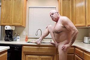 Muscular bodybuilder flashes naked through sheer workout gear