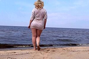 Nimble mature mommy has fun with young guys on the beach