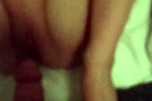 blonde woman gives foot massage to big feet in fetish video