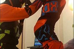 Guy in motocross costume gives an awesome blowjob to his gay partner